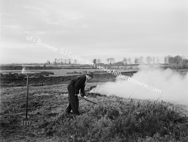 FARMER MAKING BONFIRE